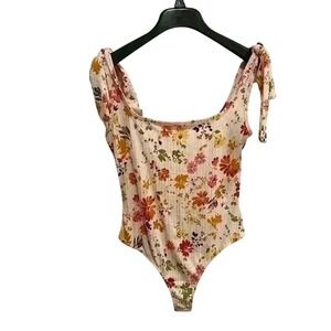 Floral bodysuit with snap closure and bow ties